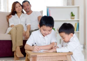 Asian boy writing